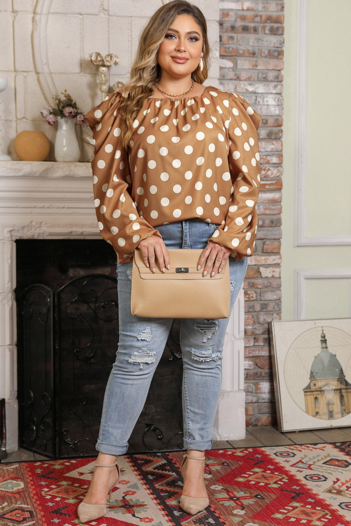 Full outfit featuring Plus Size Polka Dot Blouse styled with nude clutch and heels. Flowy silhouette and bold print enhance plus-size fashion appeal.